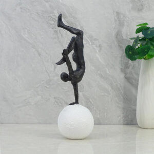 Willow Polyresin Man Balancing On Ball 30Cm in Black And White Colour