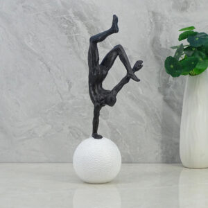 Willow Polyresin Man Balancing On Ball 30Cm in Black And White Colour